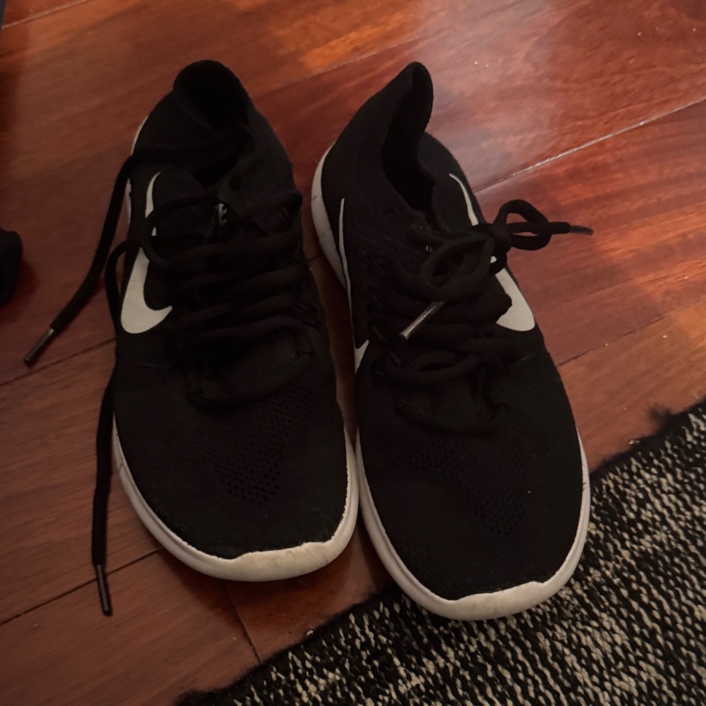 Nike Black Athletic Shoes with White Swoosh